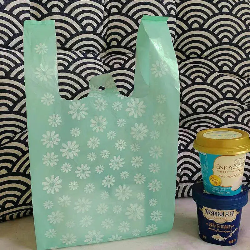 Teal daisy handle bag 10x17im apxox