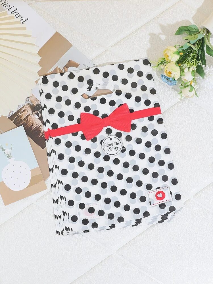 Black dots red ribbon 9x12in aprox merch bags